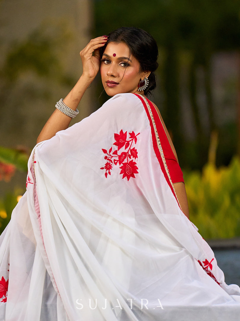 Artisanal White Georgette Saree with Red Embroidered Motifs & Beaded Border Trim