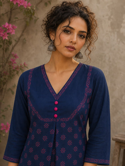 Vibrant navy blue and pink hand block print top features bell sleeves, floral detailing, and rich navy hues for effortless everyday charm.