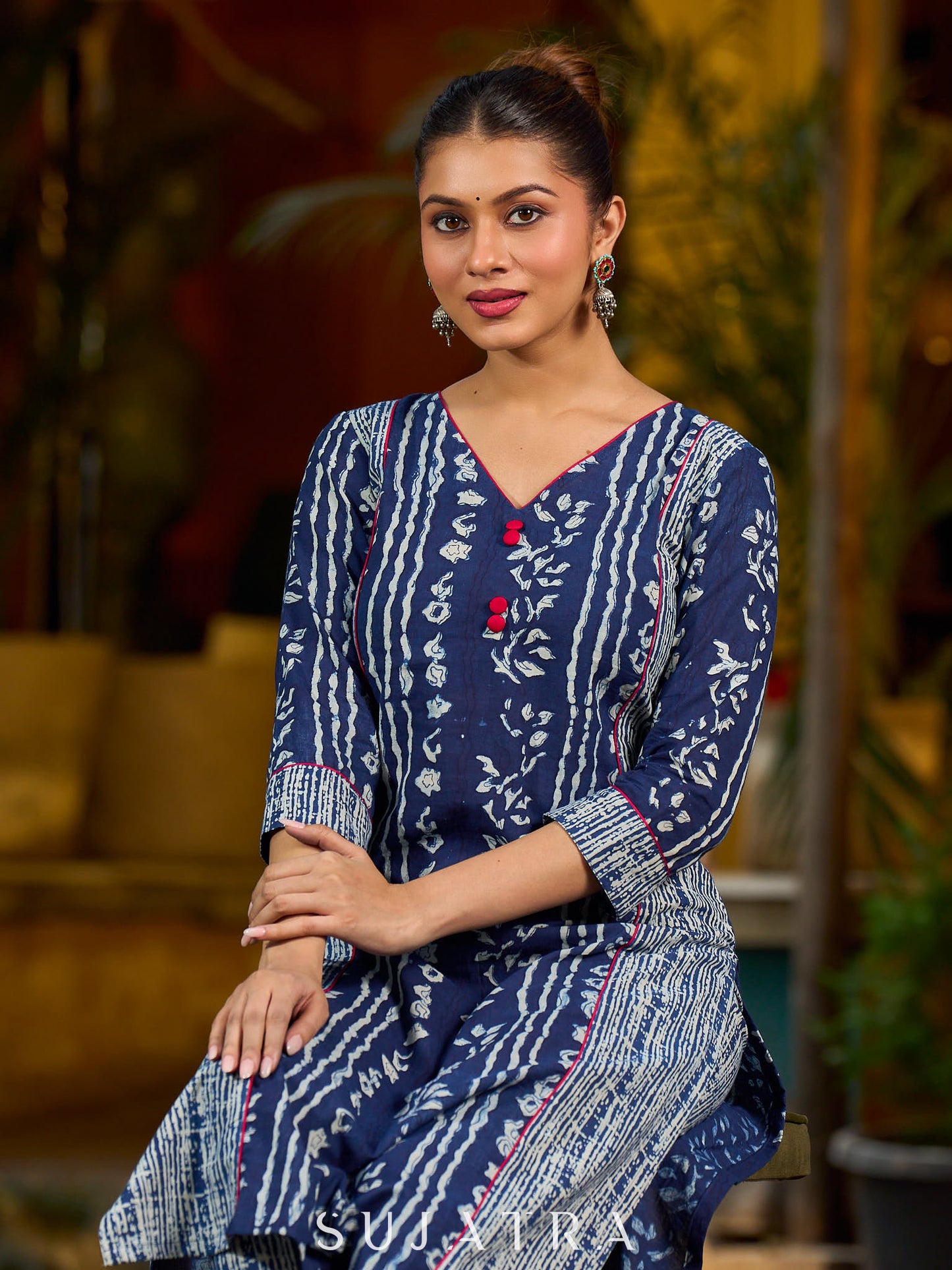 Indigo kurta elevated with delicate pink piping and buttons