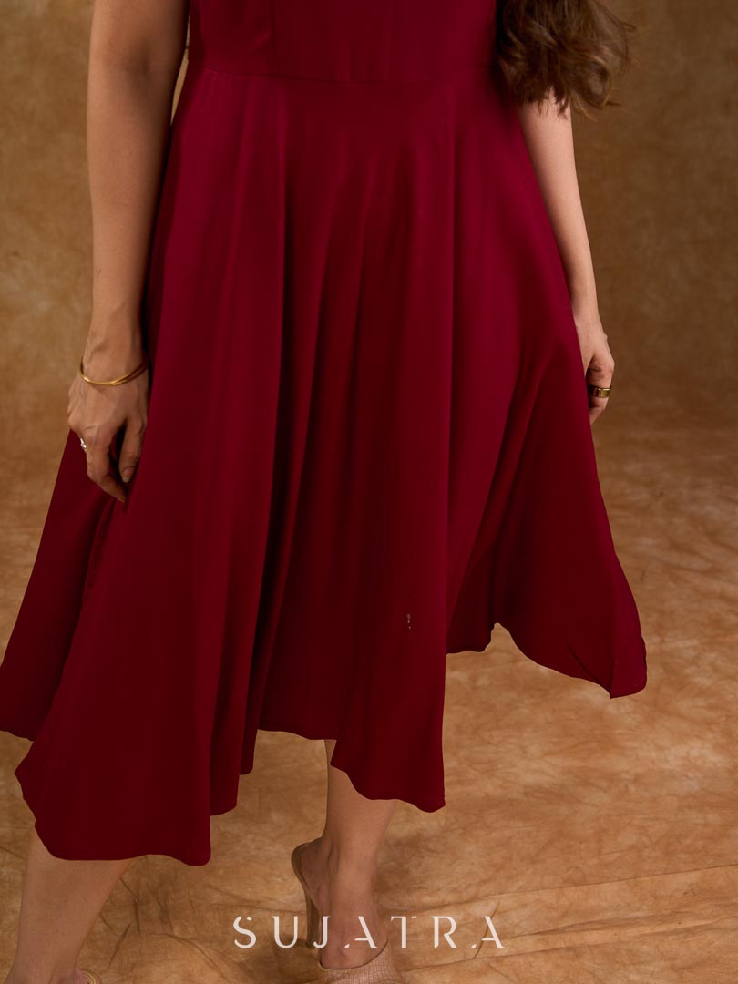 Deep maroon rayon strap dress with a fluid bias-cut silhouette, offering a soft drape, flattering shape, and an elegant, understated look for effortless everyday styling.