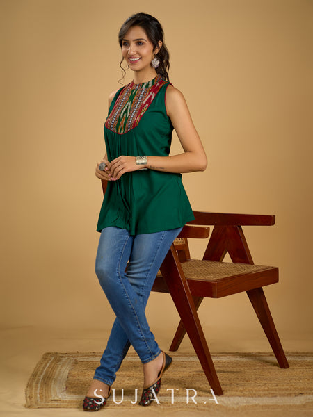 Elegant rayon green sleeveless top with ikat accents.