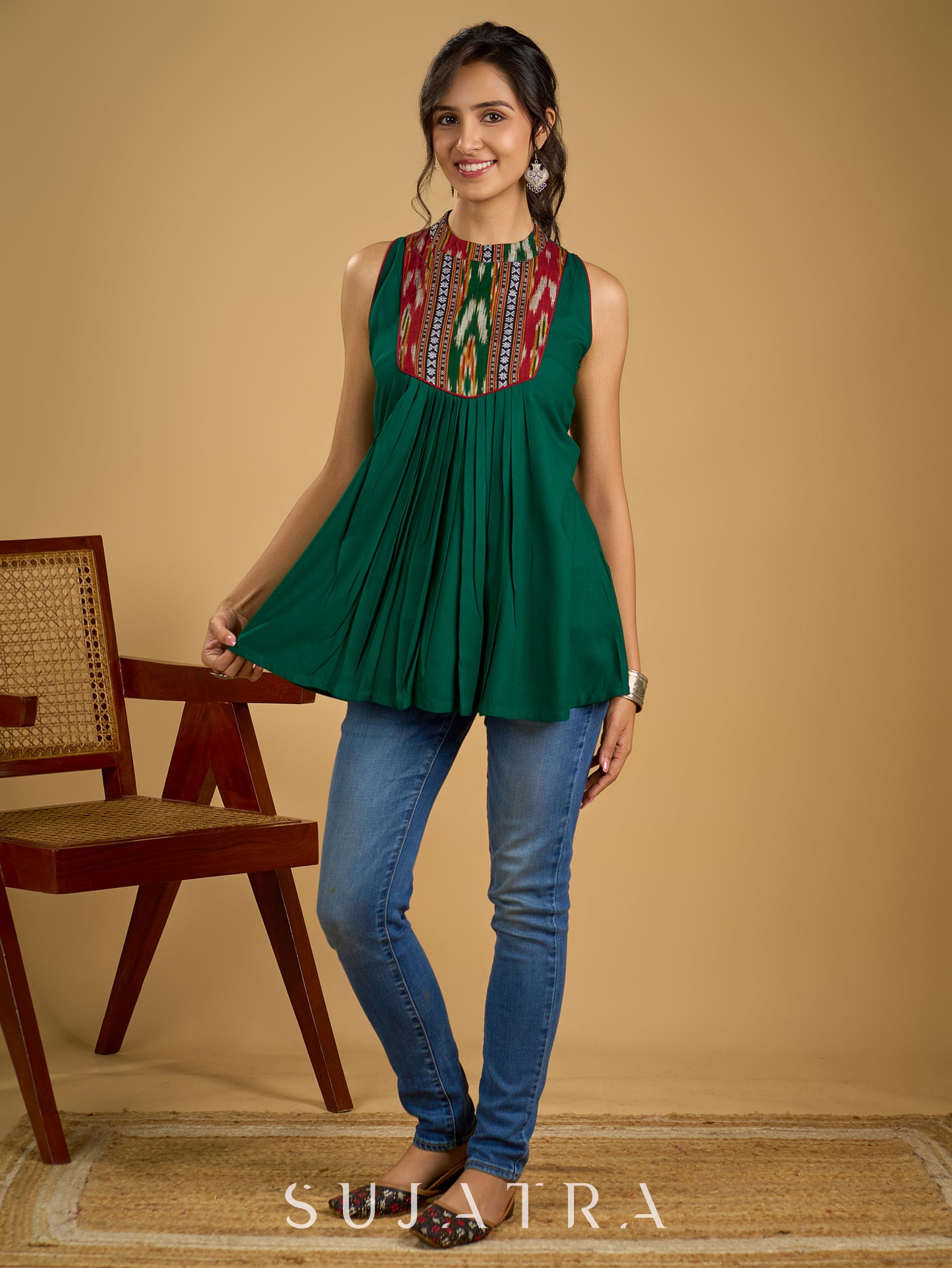 Elegant rayon green sleeveless top with ikat accents.