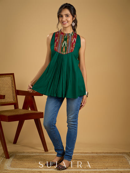 Elegant rayon green sleeveless top with ikat accents.