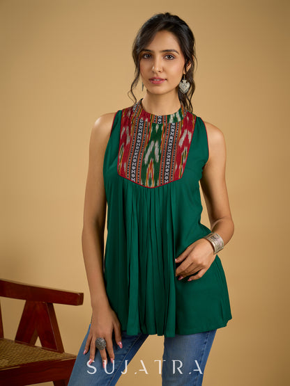 Elegant rayon green sleeveless top with ikat accents.