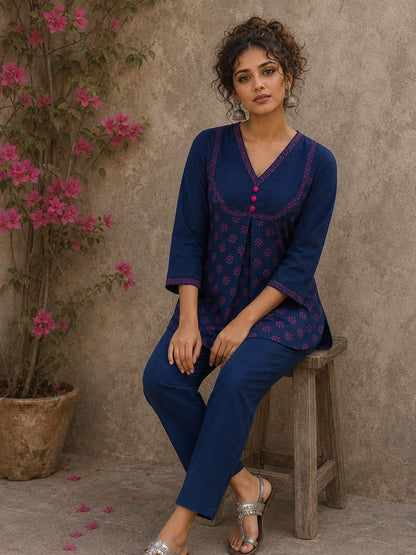 Vibrant navy blue and pink hand block print top features bell sleeves, floral detailing, and rich navy hues for effortless everyday charm.