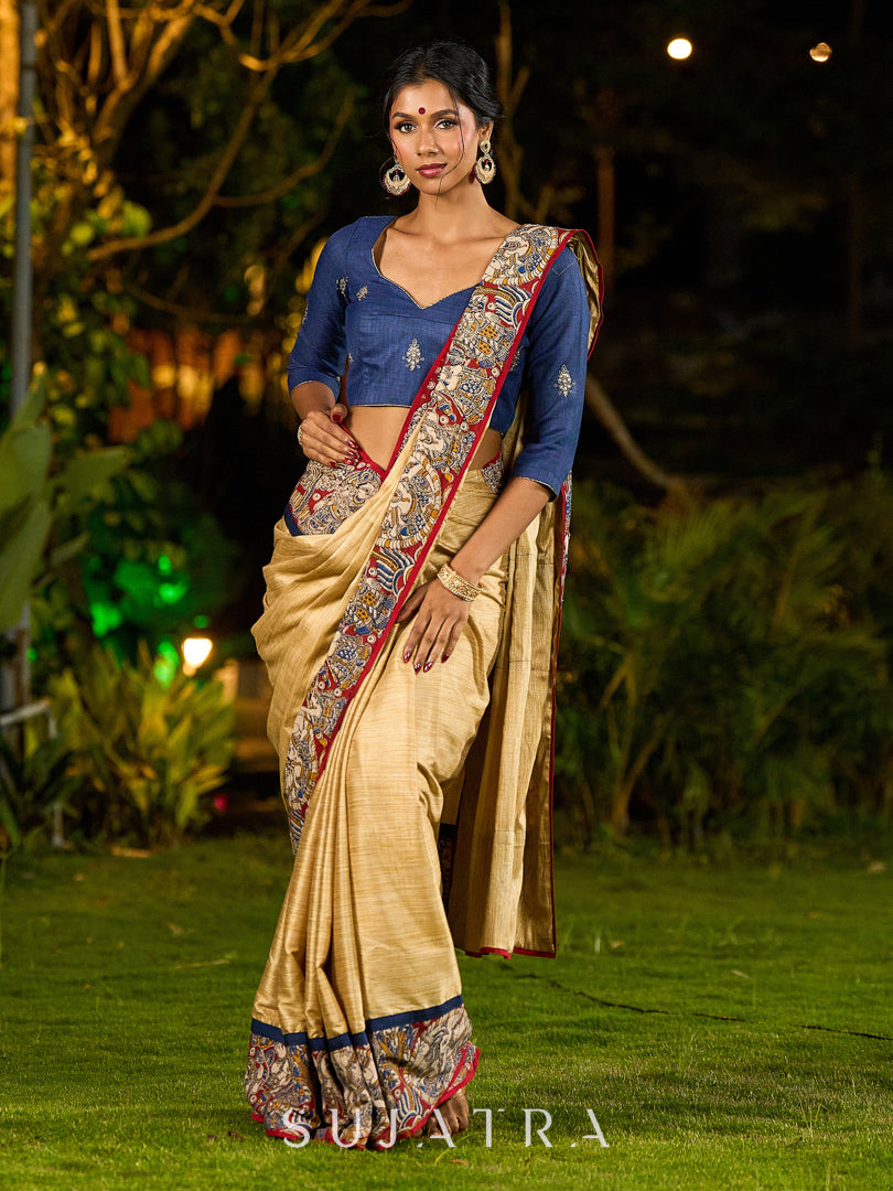 Folk-Inspired Golden Assam Silk Saree with Kalamkari Embroidered Border & Trim