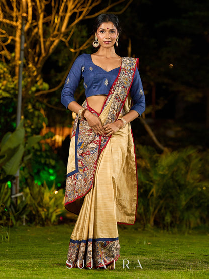 Folk-Inspired Golden Assam Silk Saree with Kalamkari Embroidered Border & Trim