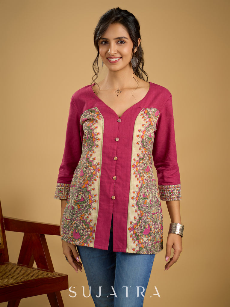 Madhubani print add charm to this magenta cotton top.