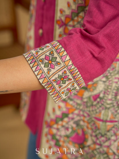 Madhubani print add charm to this magenta cotton top.