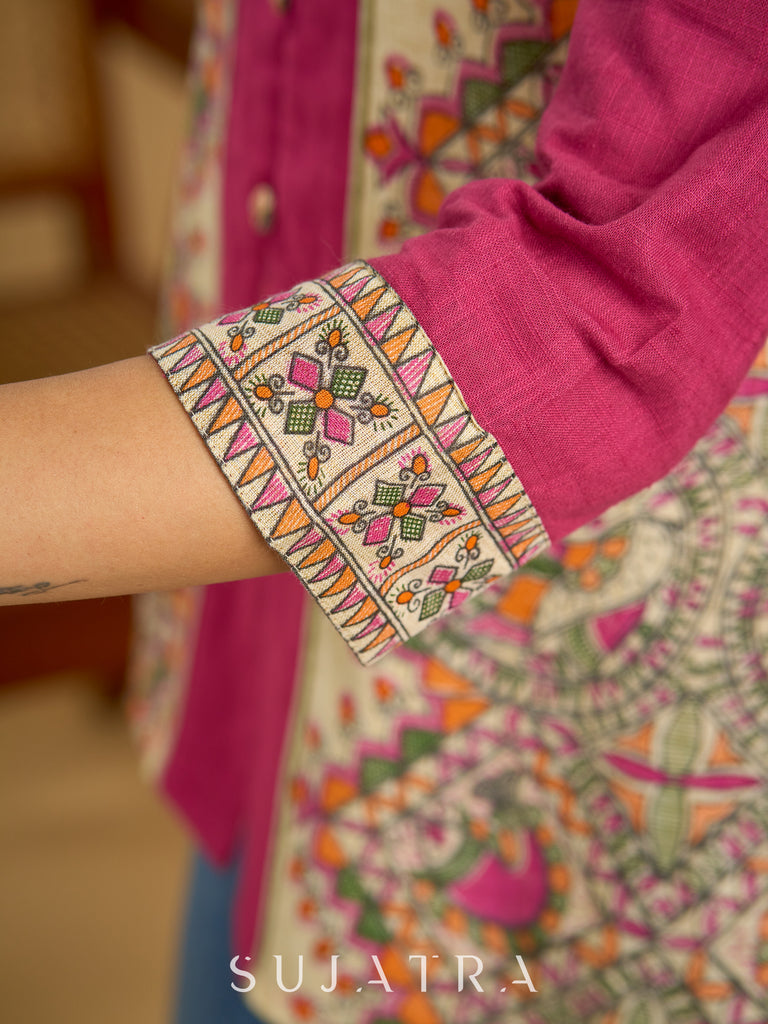 Madhubani print add charm to this magenta cotton top.