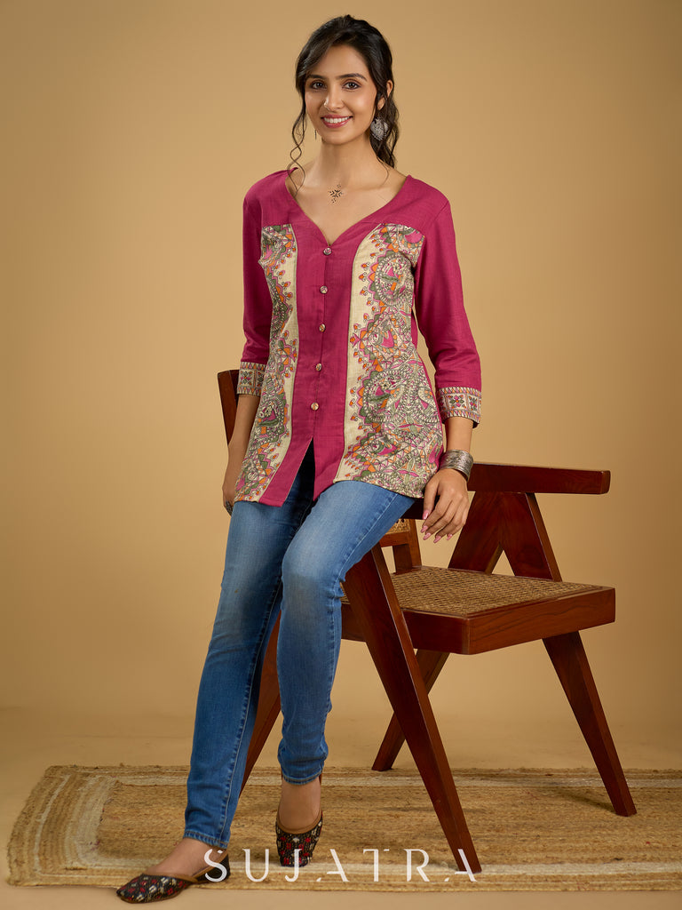 Madhubani print add charm to this magenta cotton top.