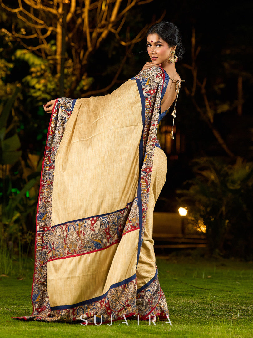 Folk-Inspired Golden Assam Silk Saree with Kalamkari Embroidered Border & Trim