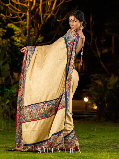 Folk-Inspired Golden Assam Silk Saree with Kalamkari Embroidered Border & Trim