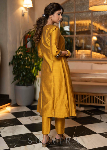 Beautiful mustard cotton silk kurta with stone work on sleeves