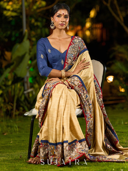 Folk-Inspired Golden Assam Silk Saree with Kalamkari Embroidered Border & Trim