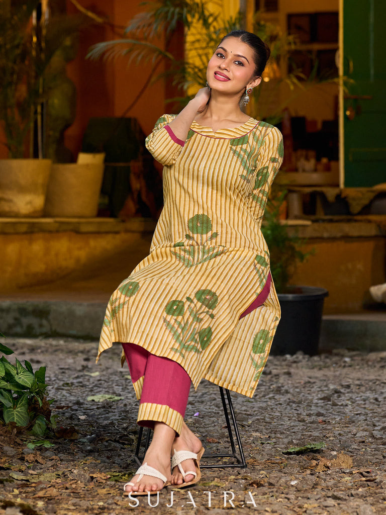 Handcrafted mustard kurta with stripe–floral print and magenta accents.