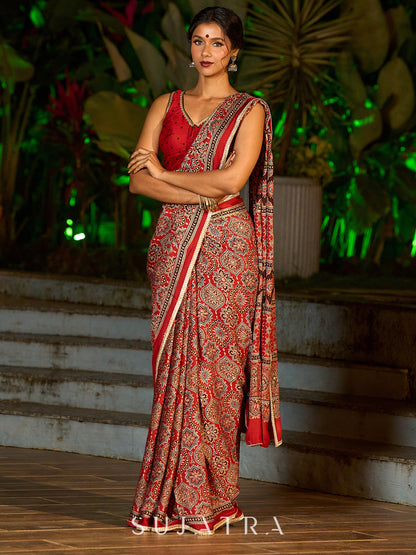 Striking Maroon Modal Silk Saree with Traditional Ajrakh Print & Contrast Gold Lace Detail & Hand Embroidered Pallu