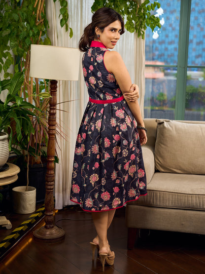 Elegant black Kalamkari dress featuring blooming florals and contrasting pink detailing for refined charm.