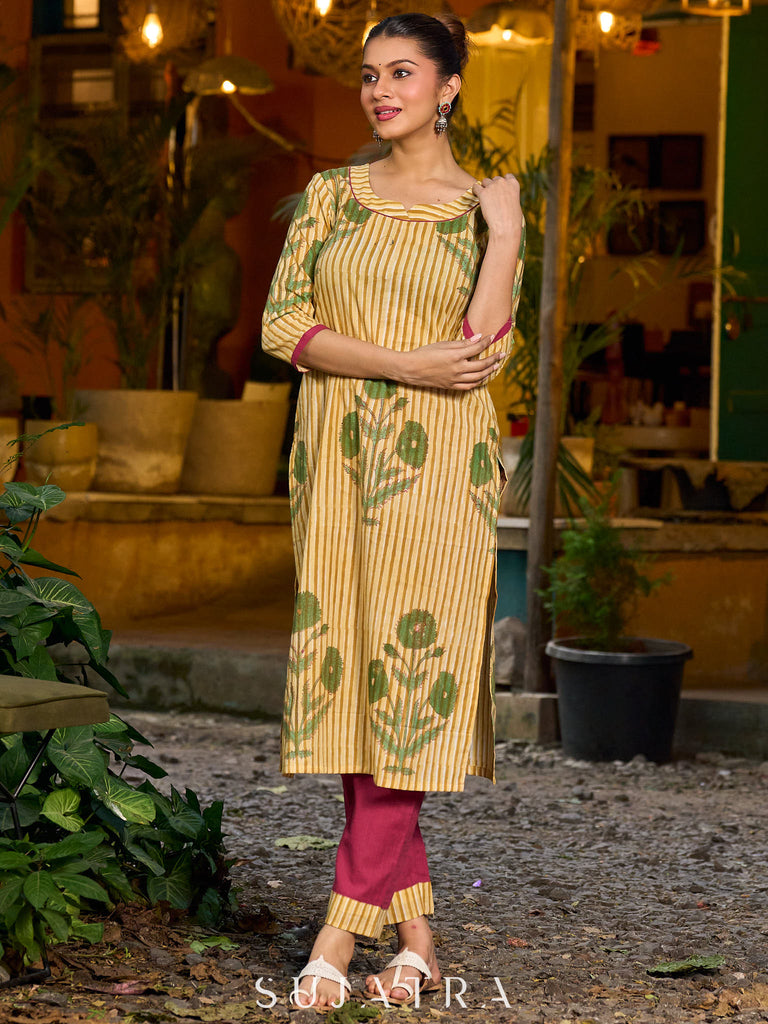 Handcrafted mustard kurta with stripe–floral print and magenta accents.