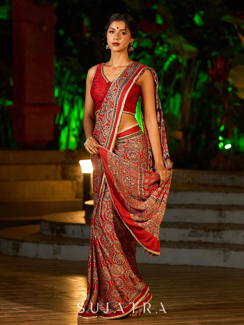 Striking Maroon Modal Silk Saree with Traditional Ajrakh Print & Contrast Gold Lace Detail & Hand Embroidered Pallu