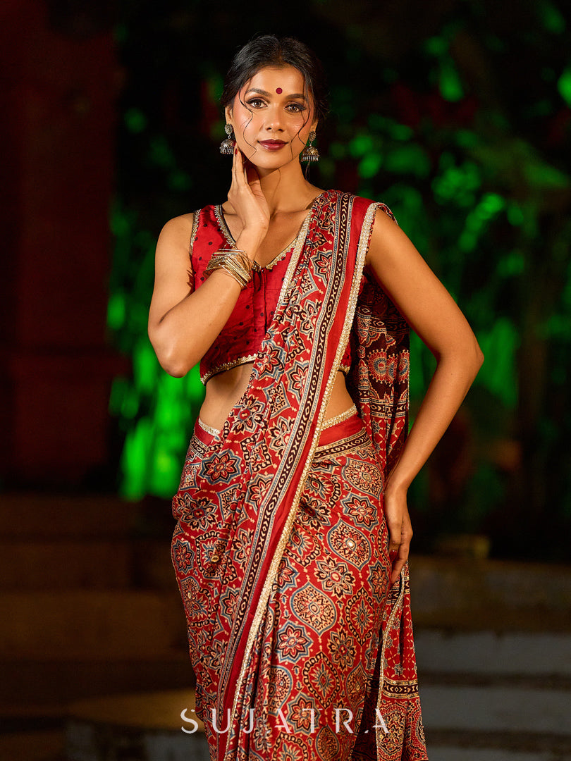 Striking Maroon Modal Silk Saree with Traditional Ajrakh Print & Contrast Gold Lace Detail & Hand Embroidered Pallu