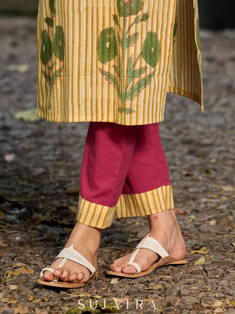 Handcrafted mustard kurta with stripe–floral print and magenta accents.