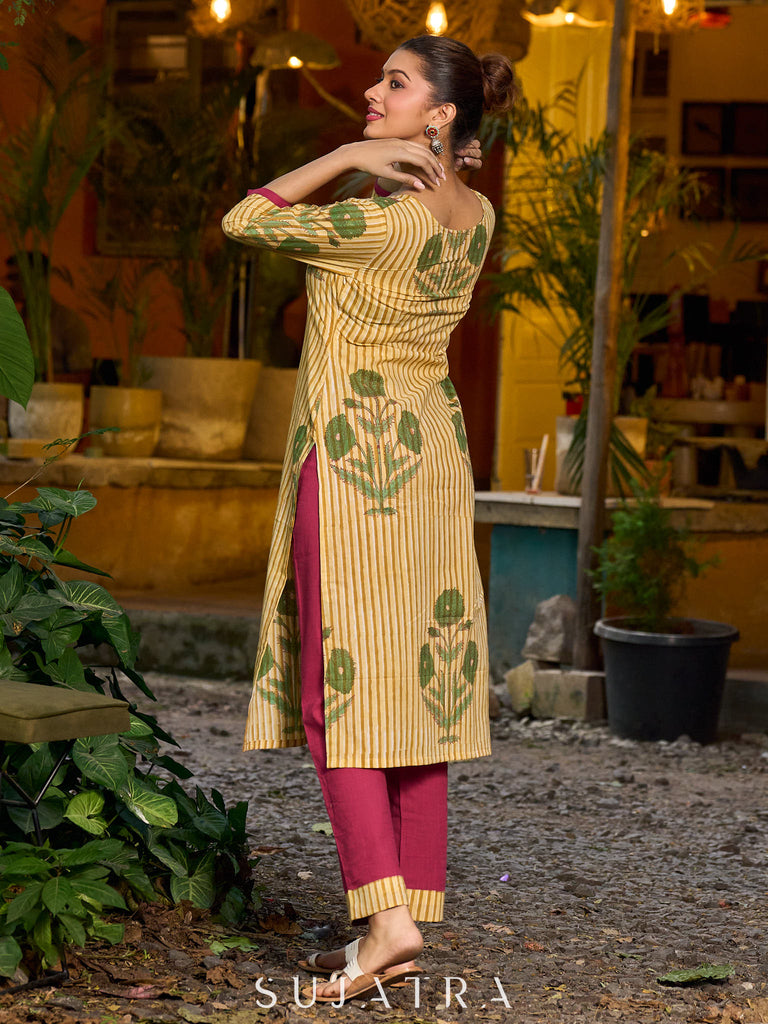 Handcrafted mustard kurta with stripe–floral print and magenta accents.