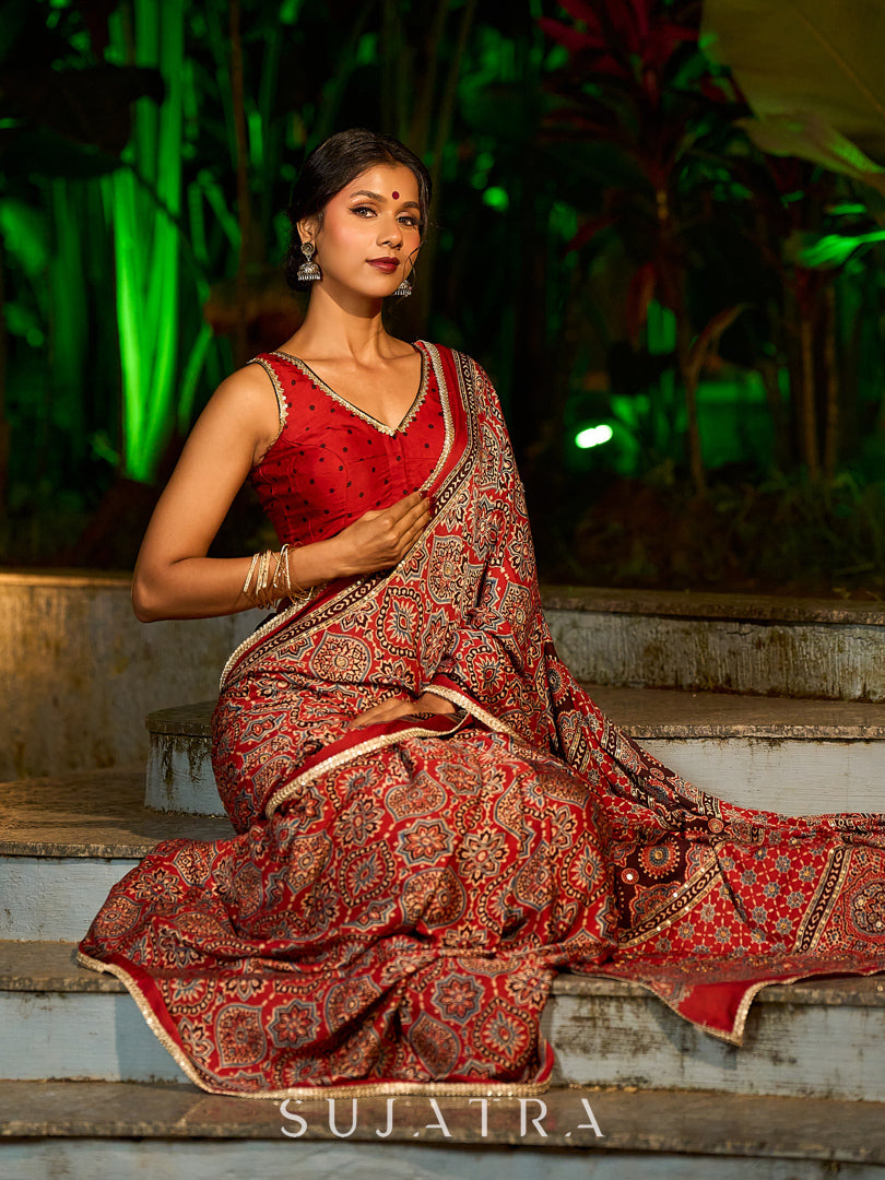 Striking Maroon Modal Silk Saree with Traditional Ajrakh Print & Contrast Gold Lace Detail & Hand Embroidered Pallu