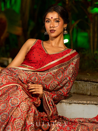 Striking Maroon Modal Silk Saree with Traditional Ajrakh Print & Contrast Gold Lace Detail & Hand Embroidered Pallu