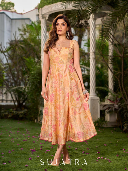 Effortless sunshine yellow floral dress designed with a delicate neckline, gathered straps, and a breezy, flowy form.