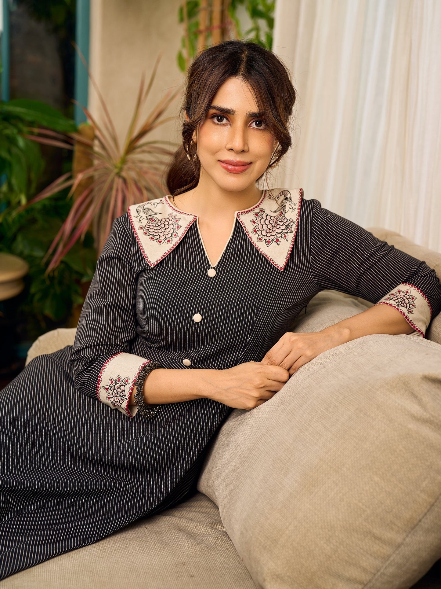 Timeless black stripes accented with exquisite hand-painted Madhubani on collars and cuffs