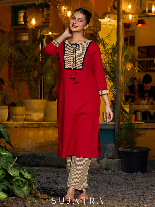 Elegant red kurta featuring a V-shaped striped neck panel