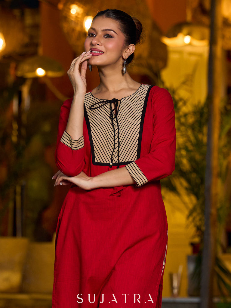 Elegant red kurta featuring a V-shaped striped neck panel
