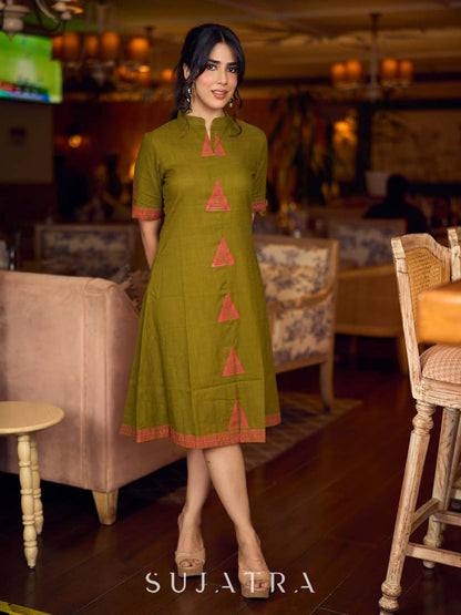 Gorgeous olive dress with pink abstract triangle hand block prints placed at the centre, sleeves, and back, featuring a mandarin collar and half sleeves for a refined, contemporary look.