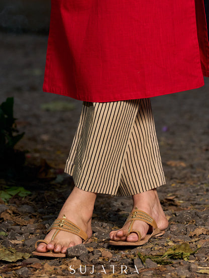 Stylish cream and black stripe straight pants with a refined silhouette