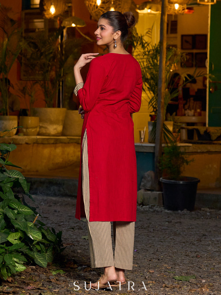 Elegant red kurta featuring a V-shaped striped neck panel