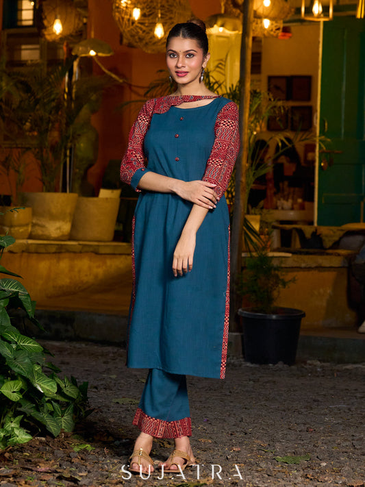 Teal kurta with contrasting Ajrakh sleeves and a chic neck cut