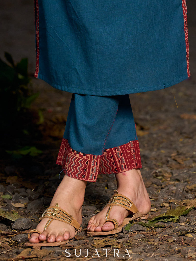 Chic teal pants featuring a bold Ajrakh contrast border.
