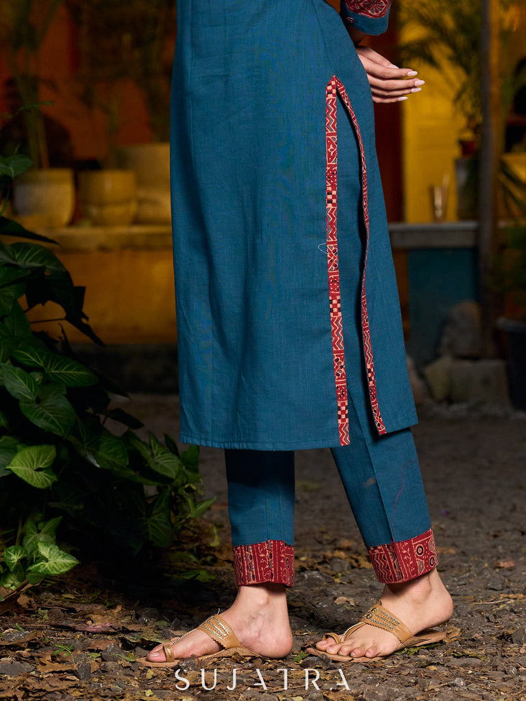Teal kurta with contrasting Ajrakh sleeves and a chic neck cut