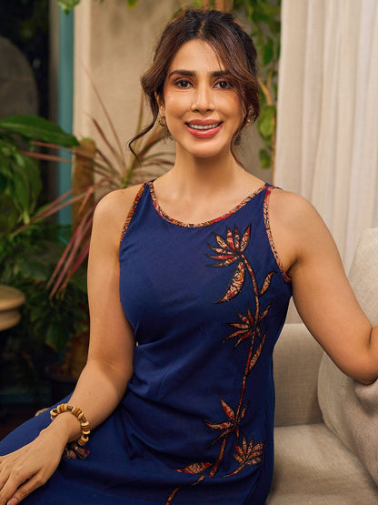 Modern navy dress enhanced by delicate, artistic Kalamkari side-applique work.