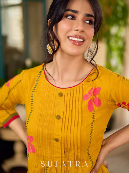 Mustard block printed pintuck dress with hand block red and pink vine floral motifs, accented with red and olive details for a rich, elegant look.