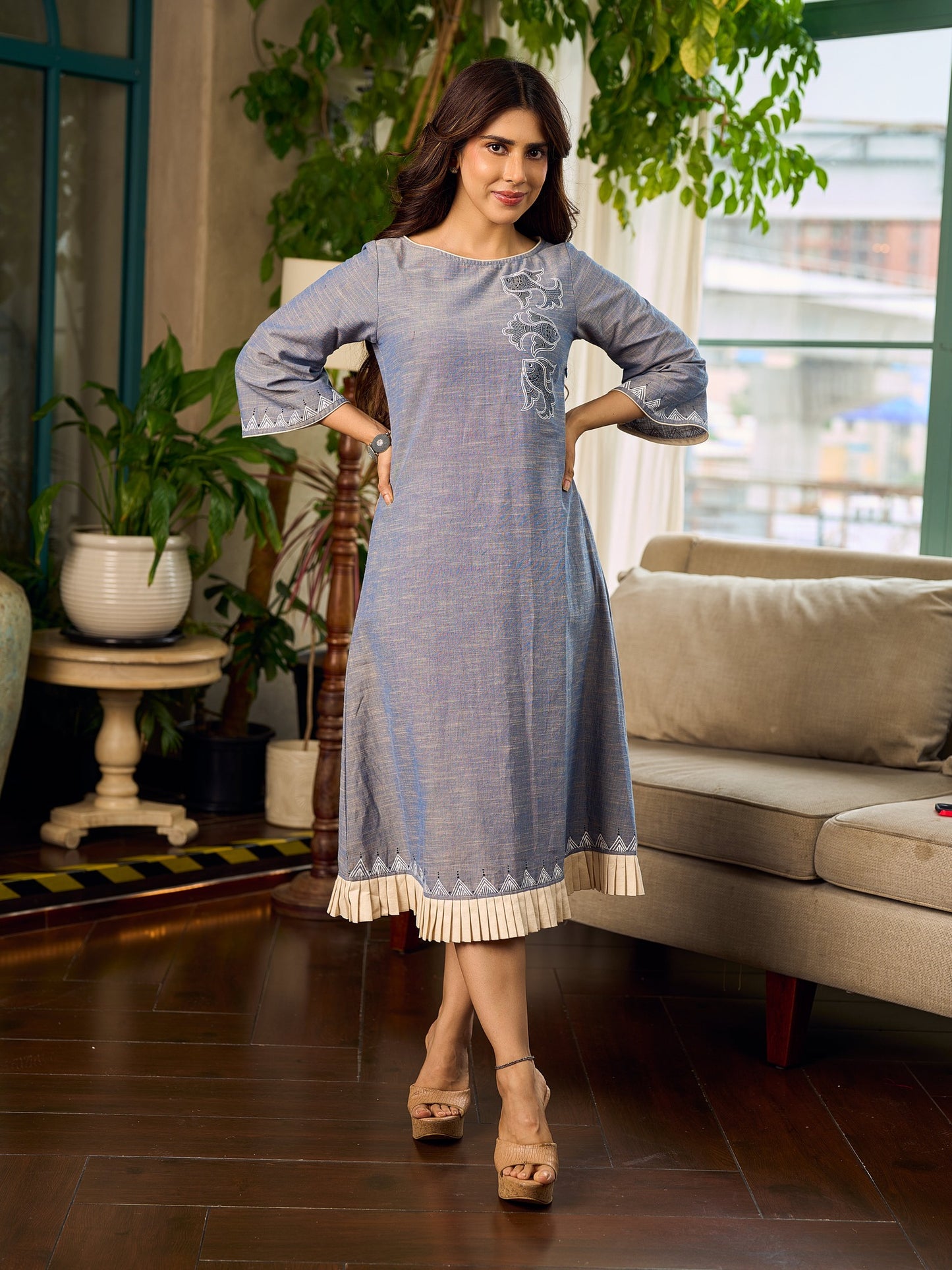 Two-tone handloom cotton dress with delicately painted Madhubani fish motifs and pleated hem.