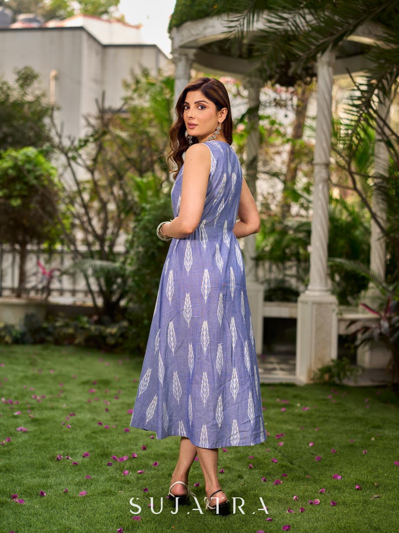 Graceful powder blue Ikat dress showcasing layered overlap details highlighted with white accents.