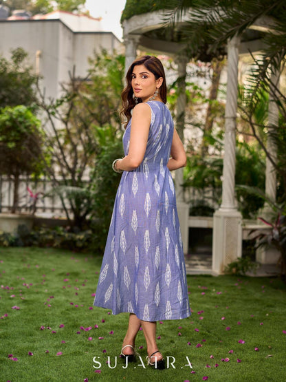 Graceful powder blue Ikat dress showcasing layered overlap details highlighted with white accents.