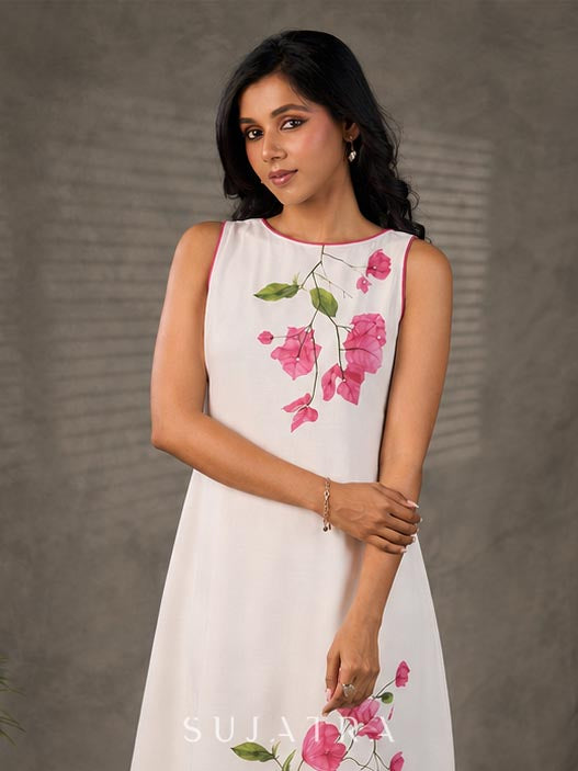 White and pink bougainvillea printed statement dress with pearl embellishments and pink accents
