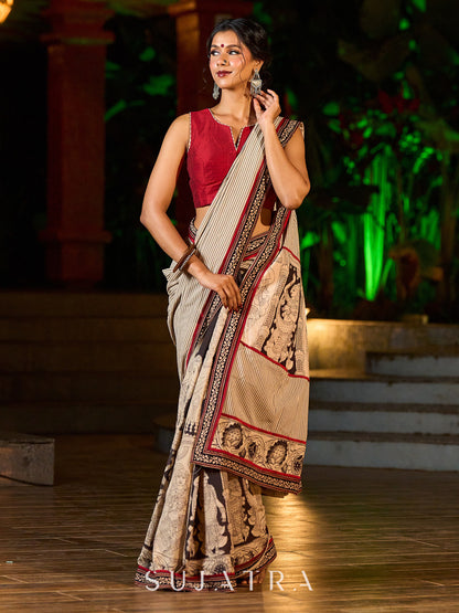 Striking Beige Kalamkari Print Saree with Striped Border & Mythological Motifs and Ajrakh Border Trim