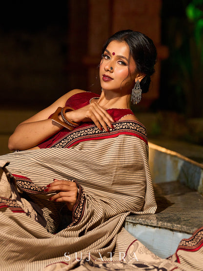 Striking Beige Kalamkari Print Saree with Striped Border & Mythological Motifs and Ajrakh Border Trim
