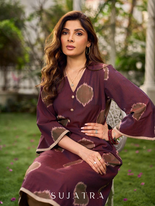 Elegant wine-purple Ikat dress with flowy sleeves, finished with a belt for a softly cinched silhouette.