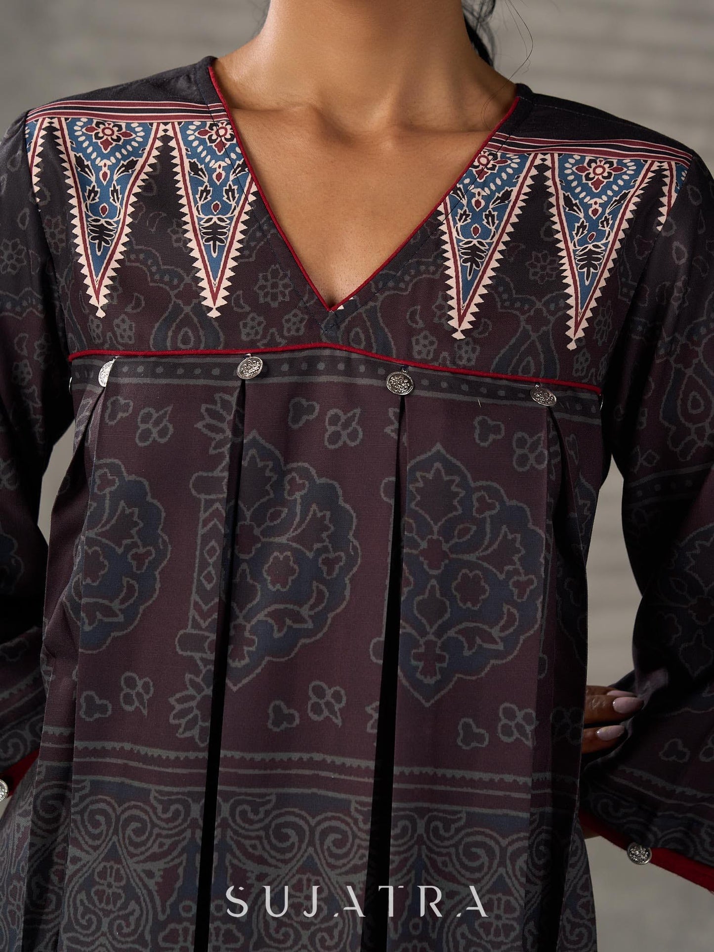 Black Ajrakh printed dress with pleats, maroon accents, and silver embellishments.