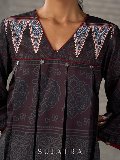 Black Ajrakh printed dress with pleats, maroon accents, and silver embellishments.